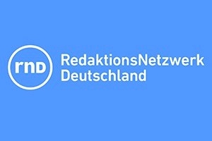 Logo des RedaktionsNetzwerks Deutschland auf blauem Hintergrund.